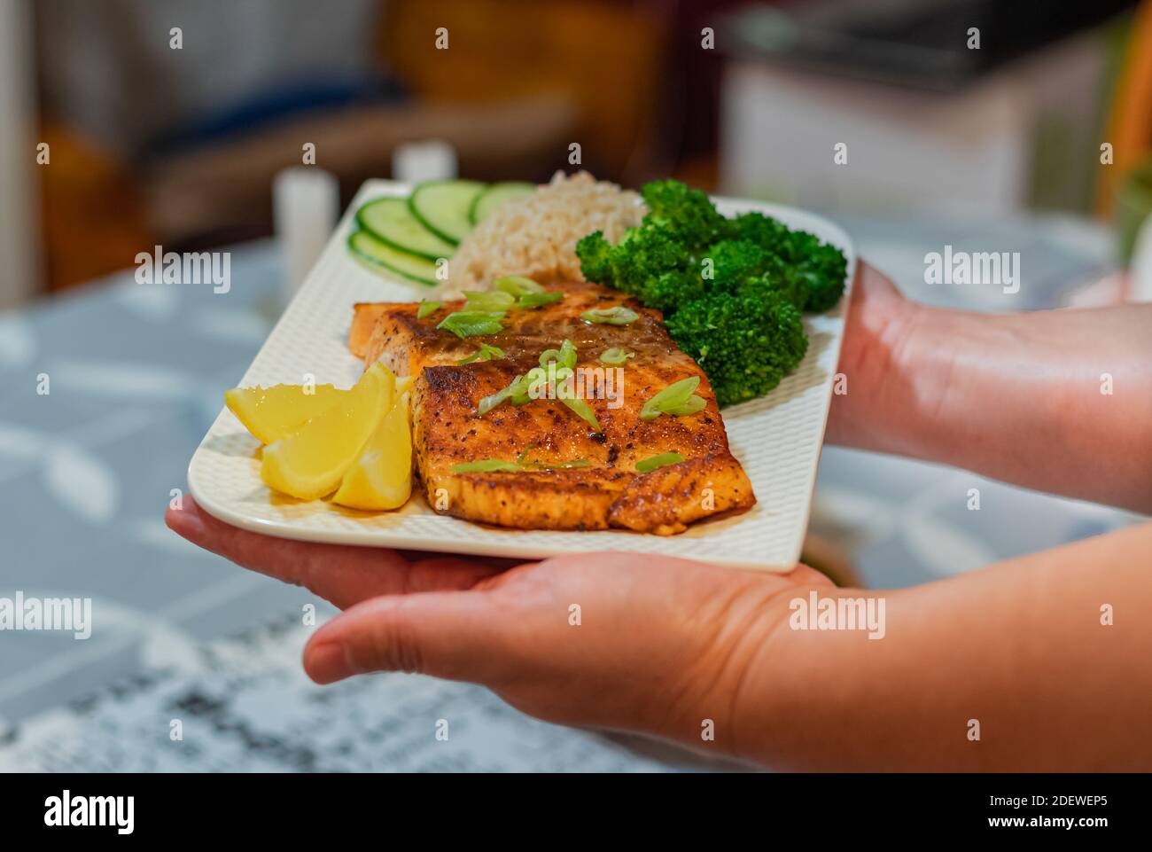 Homemade delicious salmon with vegetables. Close up, selective focus, concept photo healthy food. Stock Photo