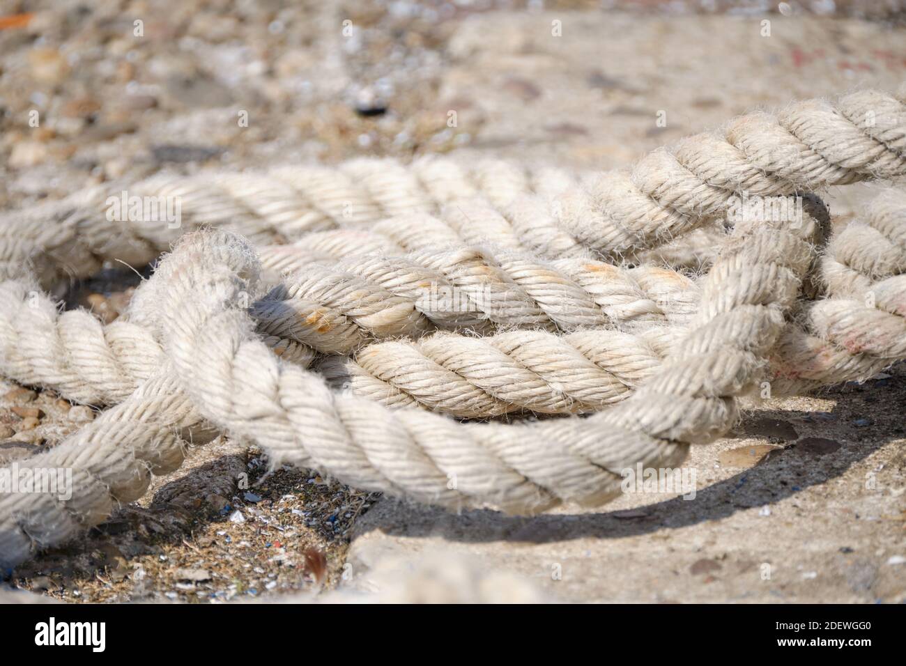 Abstract Background texture of thick, strong rope on the harbor quay ...