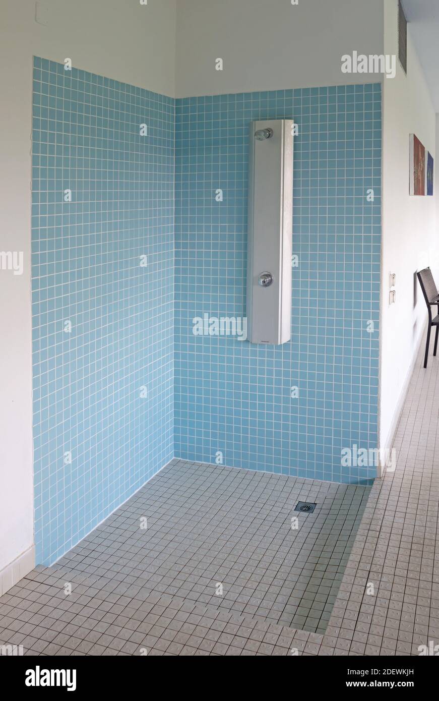Interior of a shower room in a swimming pool, blue tiles Stock Photo - Alamy
