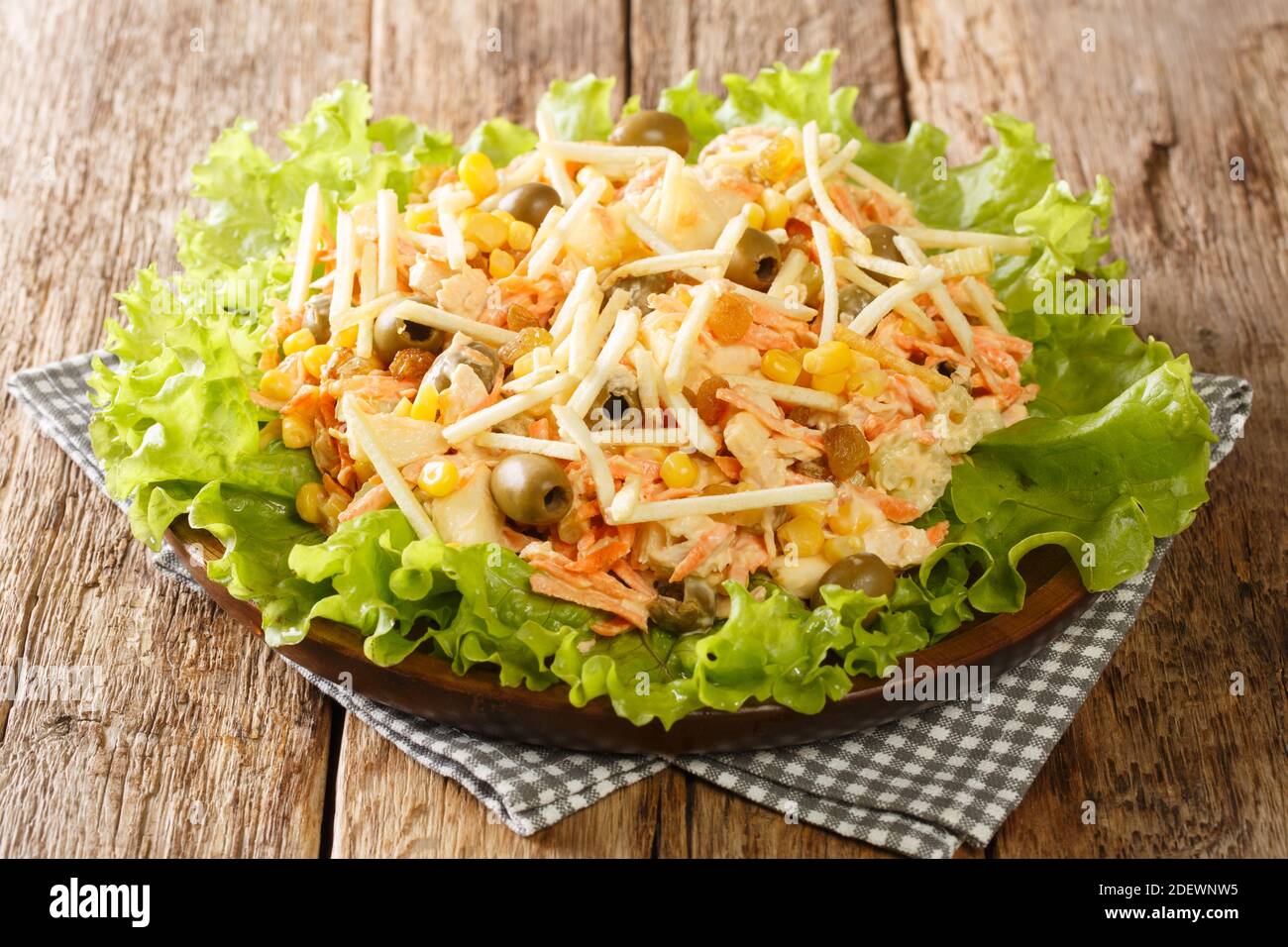 Serving Of Homemade Salpicao Salad Of Chicken Vegetables Raisins Olives And Potato Sticks Close Up In A Plate On The Table Horizontal Stock Photo Alamy
