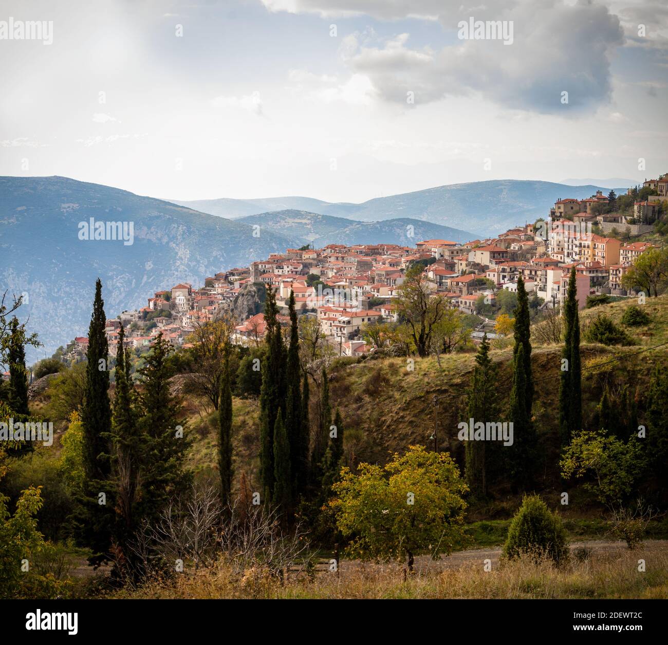 Scenic town with traditional ceramic tile rooftops surrounded by ...