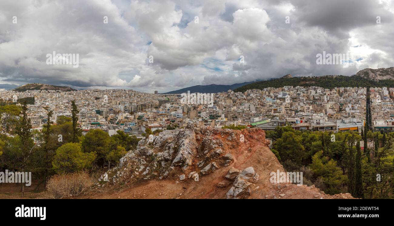 View of Athens from Strefi Hill during a morning with beautiful white clouds. The hill is located in Exarchia district, in Athens, Greece, Europe Stock Photo