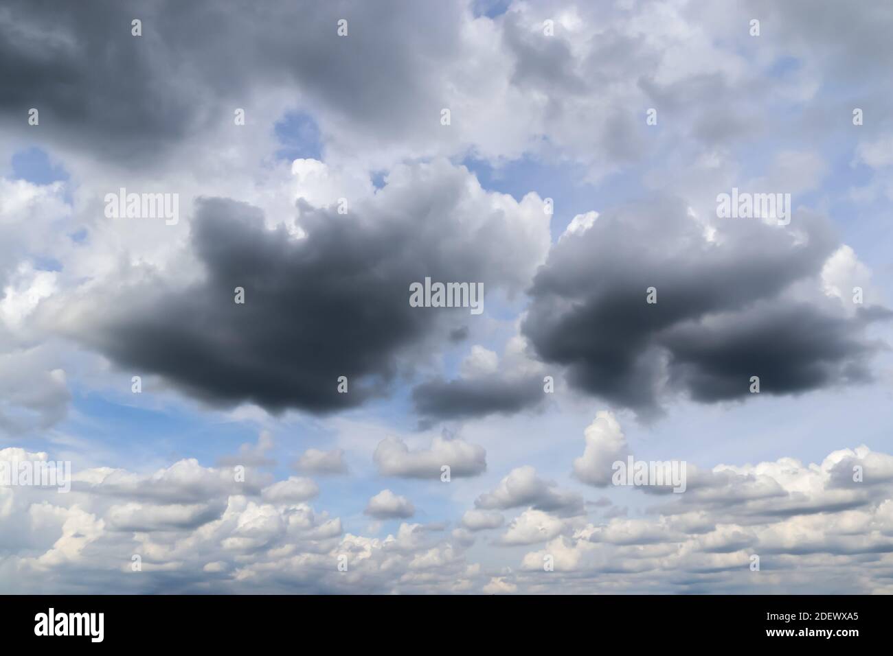 A low angle shot of the dark cloud formations in the sky before a ...