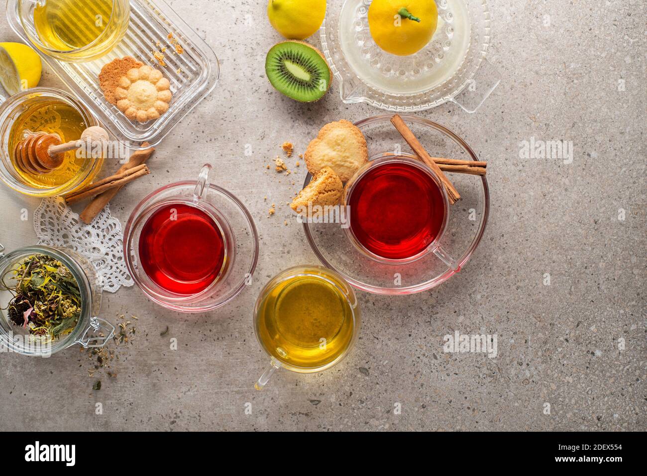 Herbal tea, green tea, fruit tea cups on grey background Stock Photo