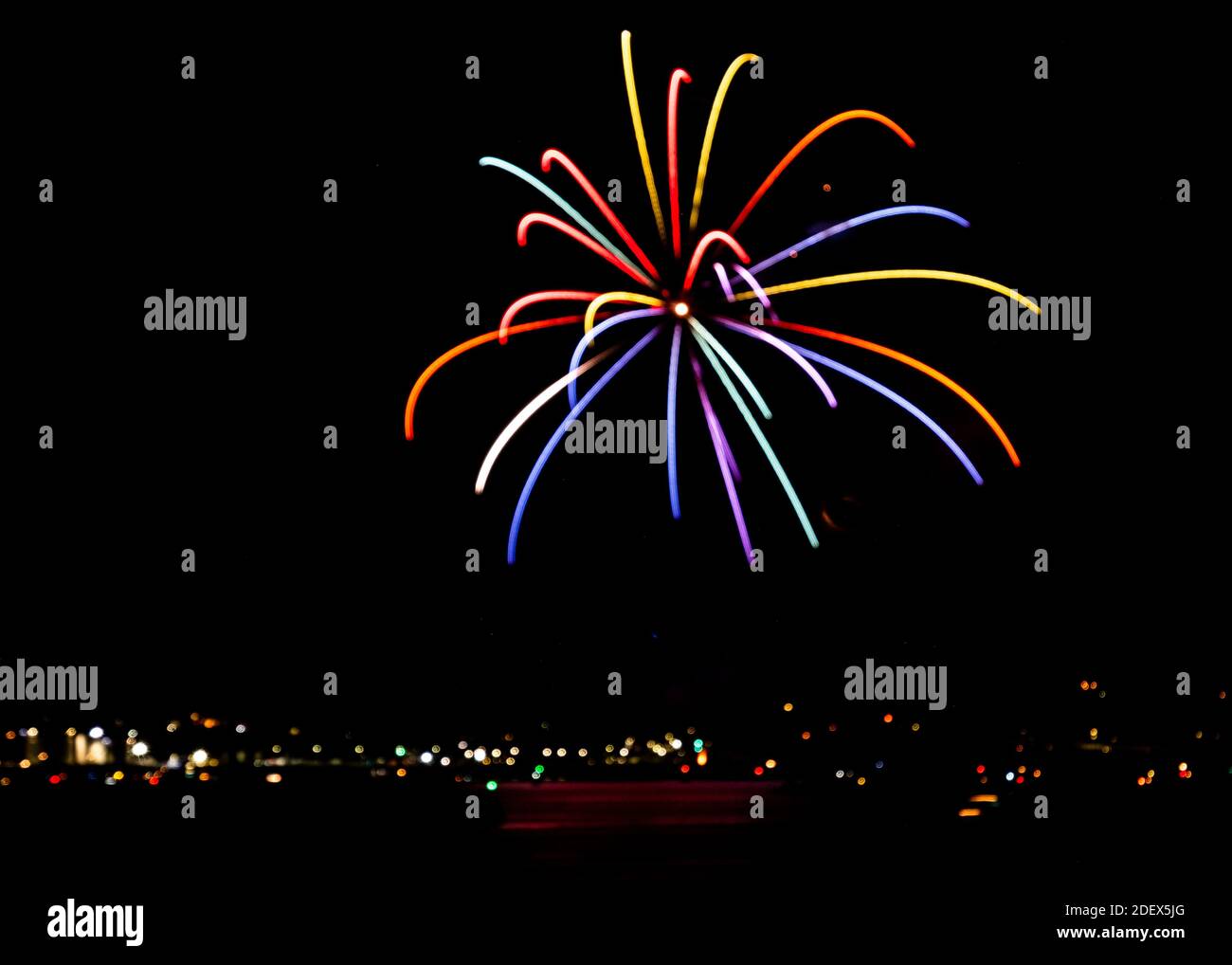 Deliberately de-focused firework explosion over the harbour at Plymouth as part of 2018 British Firework Championships from 'Fully Fused Fireworks'  A Stock Photo