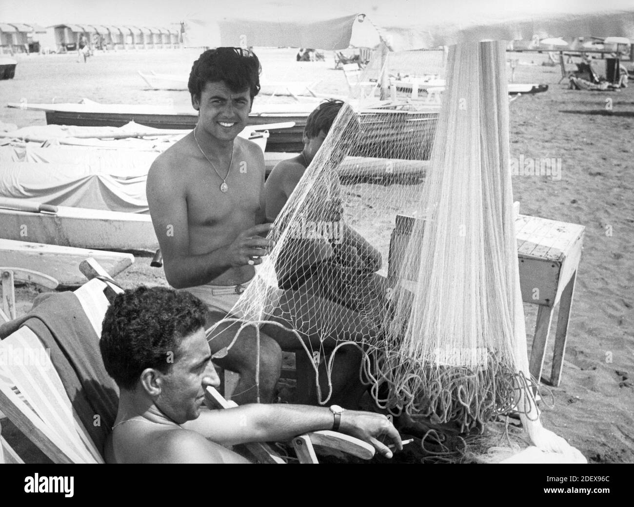 The singer Little Tony (Antonio Ciacci) on the beach, Castel Fusano (RM), September 1963. --- Il cantante Little Tony (Antonio Ciacci) in spiaggia, Castel Fusano (RM), Settembre 1963. Stock Photo