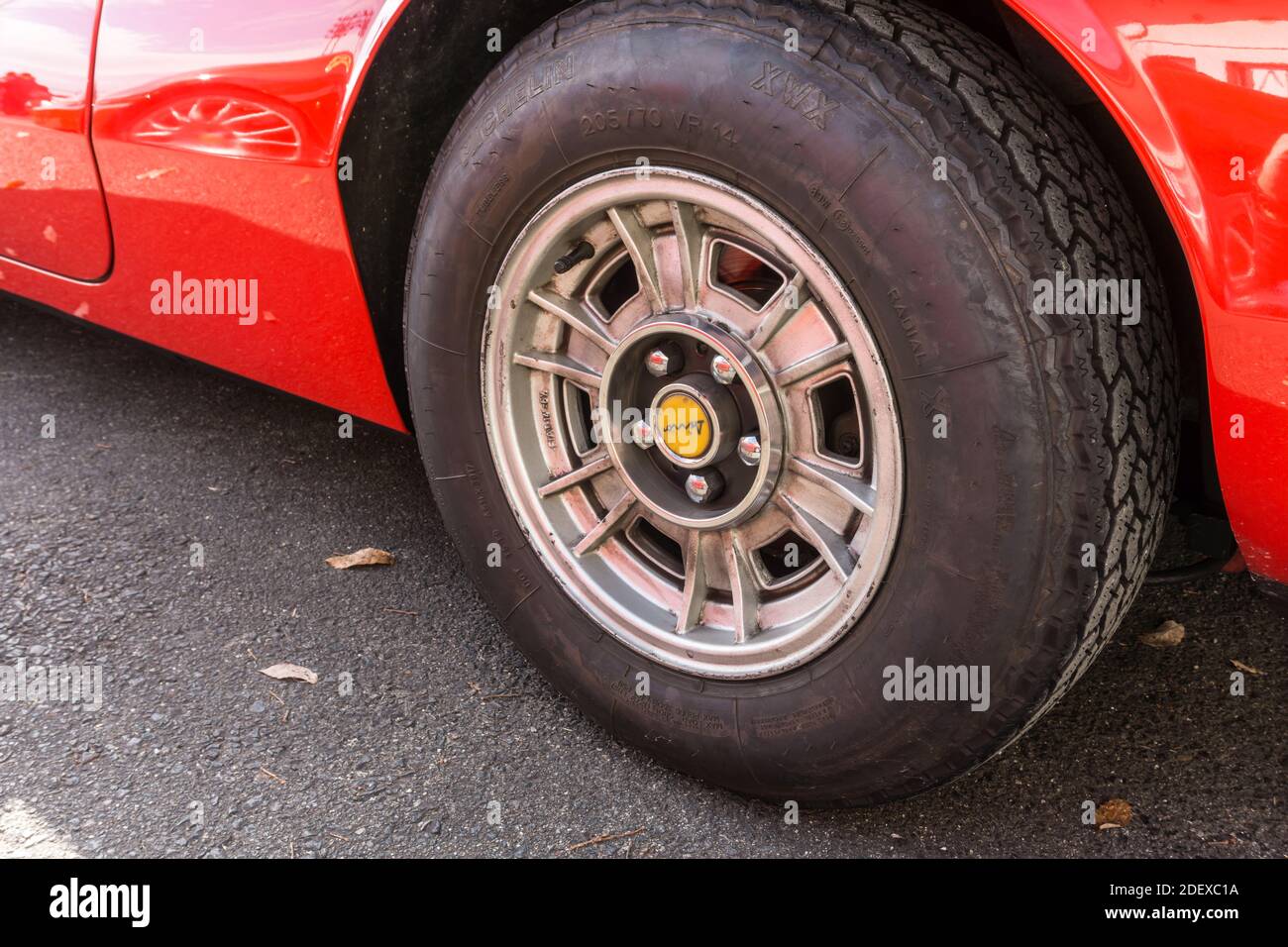 Close up detail of the alloy wheel and tyre on a red 1970s Ferrari Dino 246 GT sports car Stock Photo