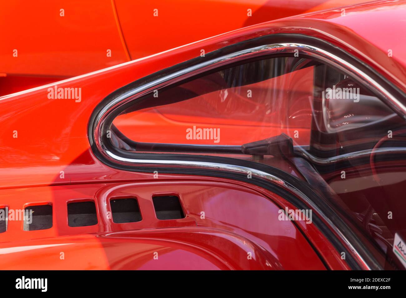 Close up detail of the curved rear window and engine cover on a red 1970s Ferrari Dino 246 GT sports car Stock Photo