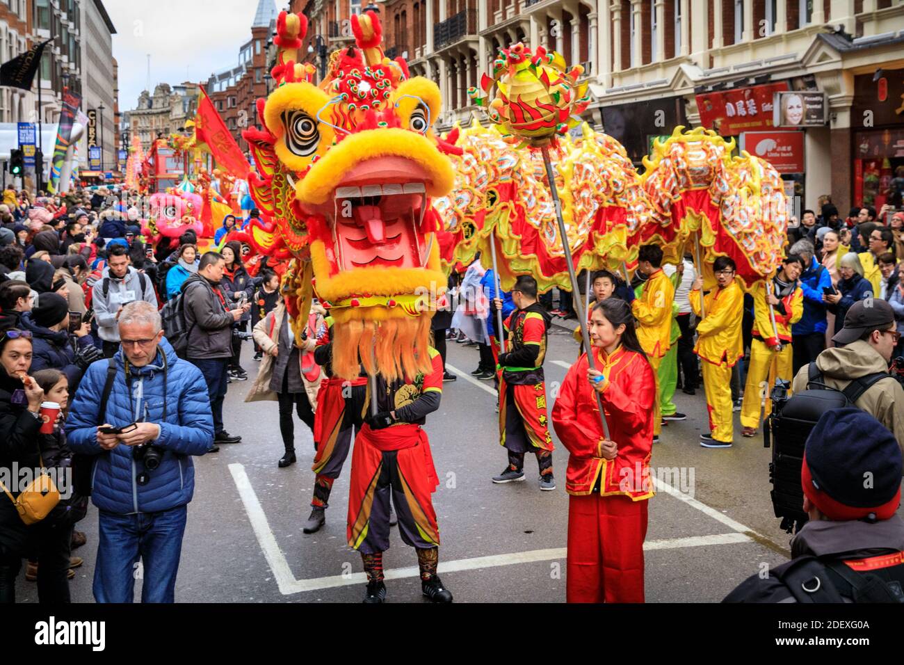 Dragon dance. Chinese New Year celebrations and parade, performers at festival around Chinatown, London, UK Stock Photo