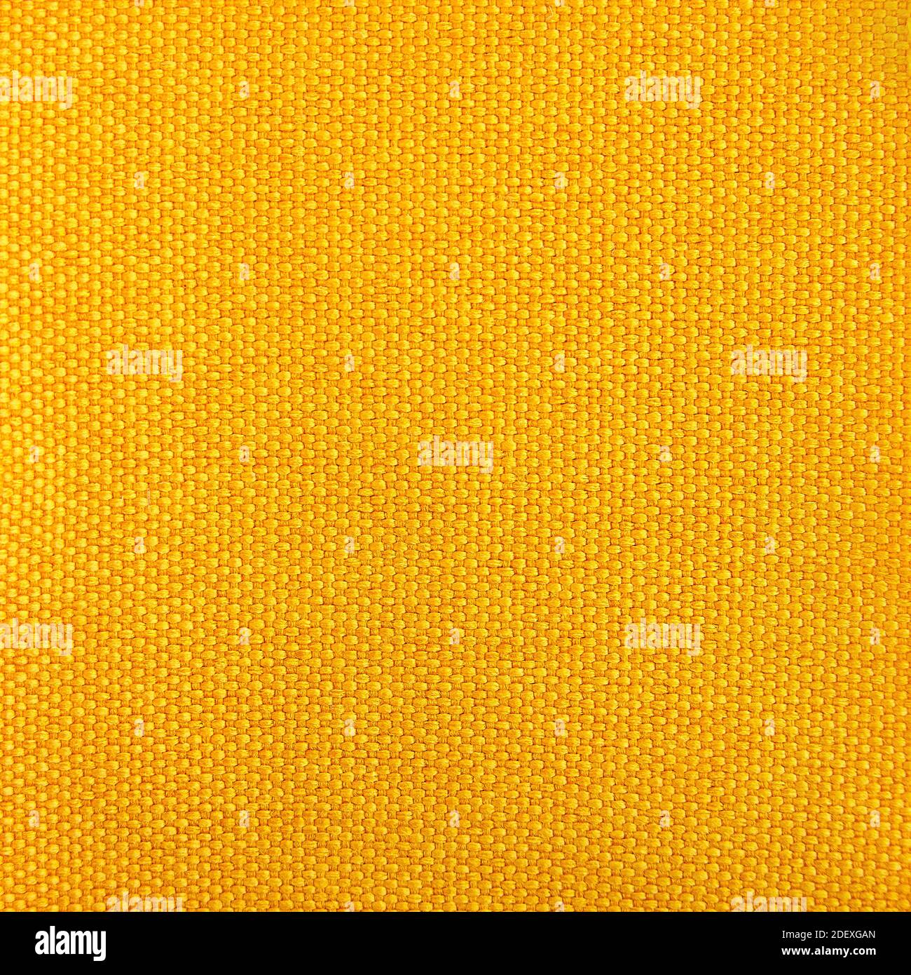 Fabric texture deep yellow color for background or design Stock Photo