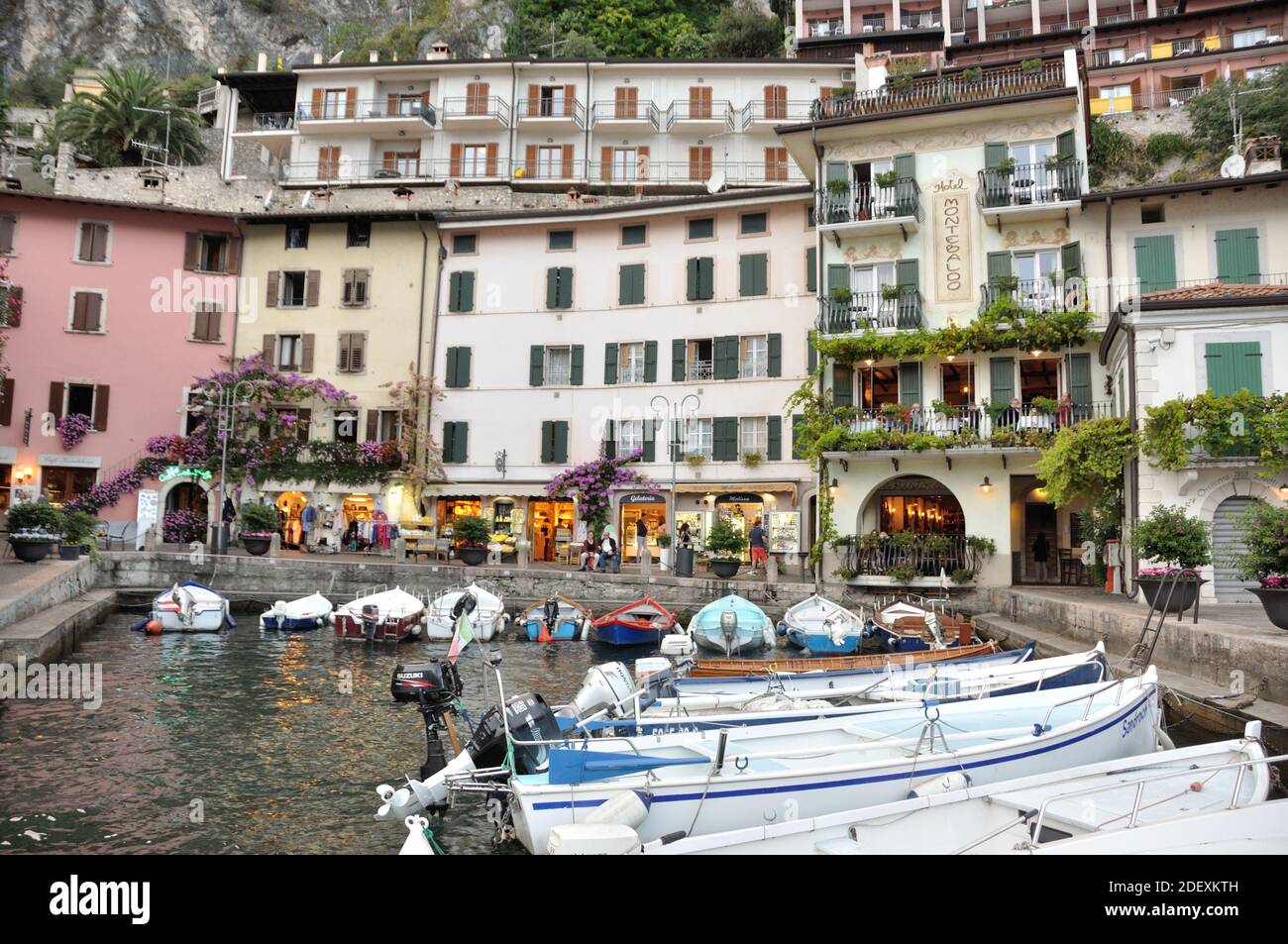 LIMONE SUL GARDA, ITALY - Sep 21, 2016: Beautiful buildings and boats at the harbour of Limone Sul Garda, at lake Lago di Garda, Italy Stock Photo