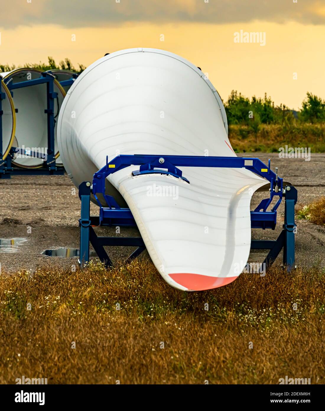 Wind turbine wings on the ground ready for export to new customers. . High quality photo Stock Photo