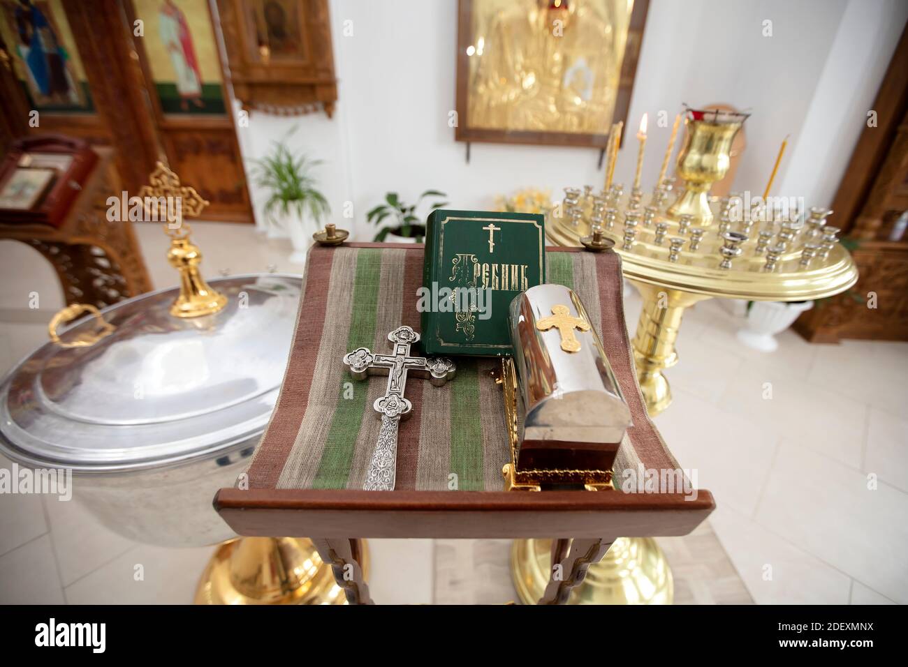 A church table with a Bible and church supplies Stock Photo Alamy