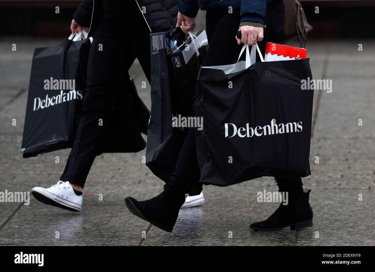 Nottingham, Nottinghamshire, UK. 2nd December 2020. Women carry  Debenhams bags after the department store chain collapsed but opened its stores for a stock clearance sale. Credit Darren Staples/Alamy Live News. Stock Photo