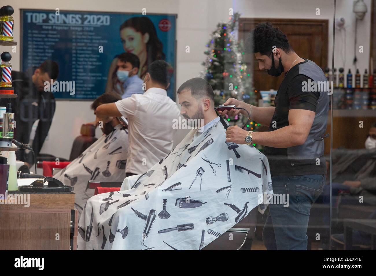 Streatham, UK, 2 December 2020: Barbershops were busy as they re-opened today after 4-weeks of lockdown designed to reduce coronavirus transmission rates. Anna Watson/Alamy Live News Stock Photo