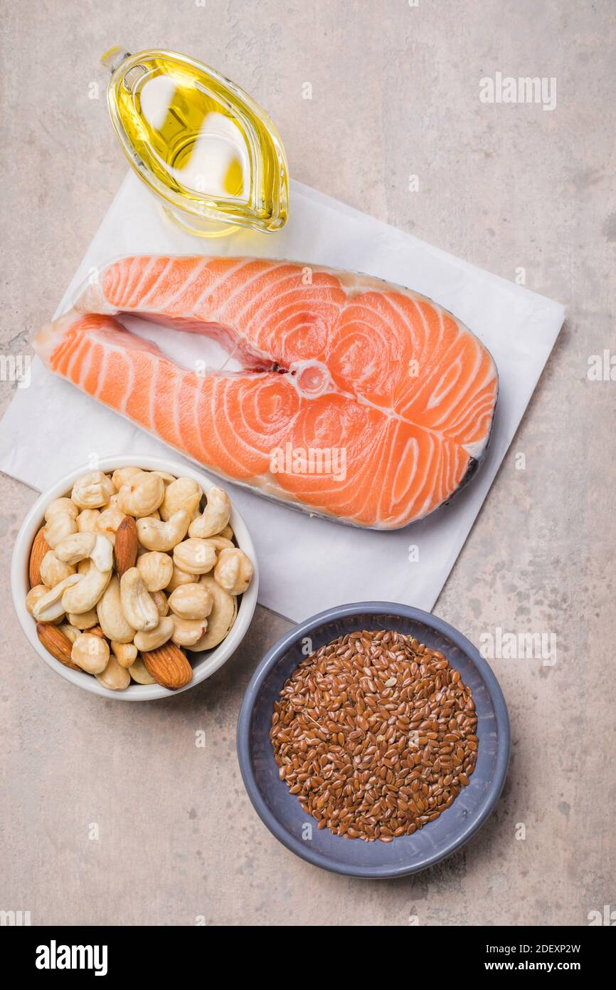 Omega 3 food sources and omega 6 on concrete background, top view copy