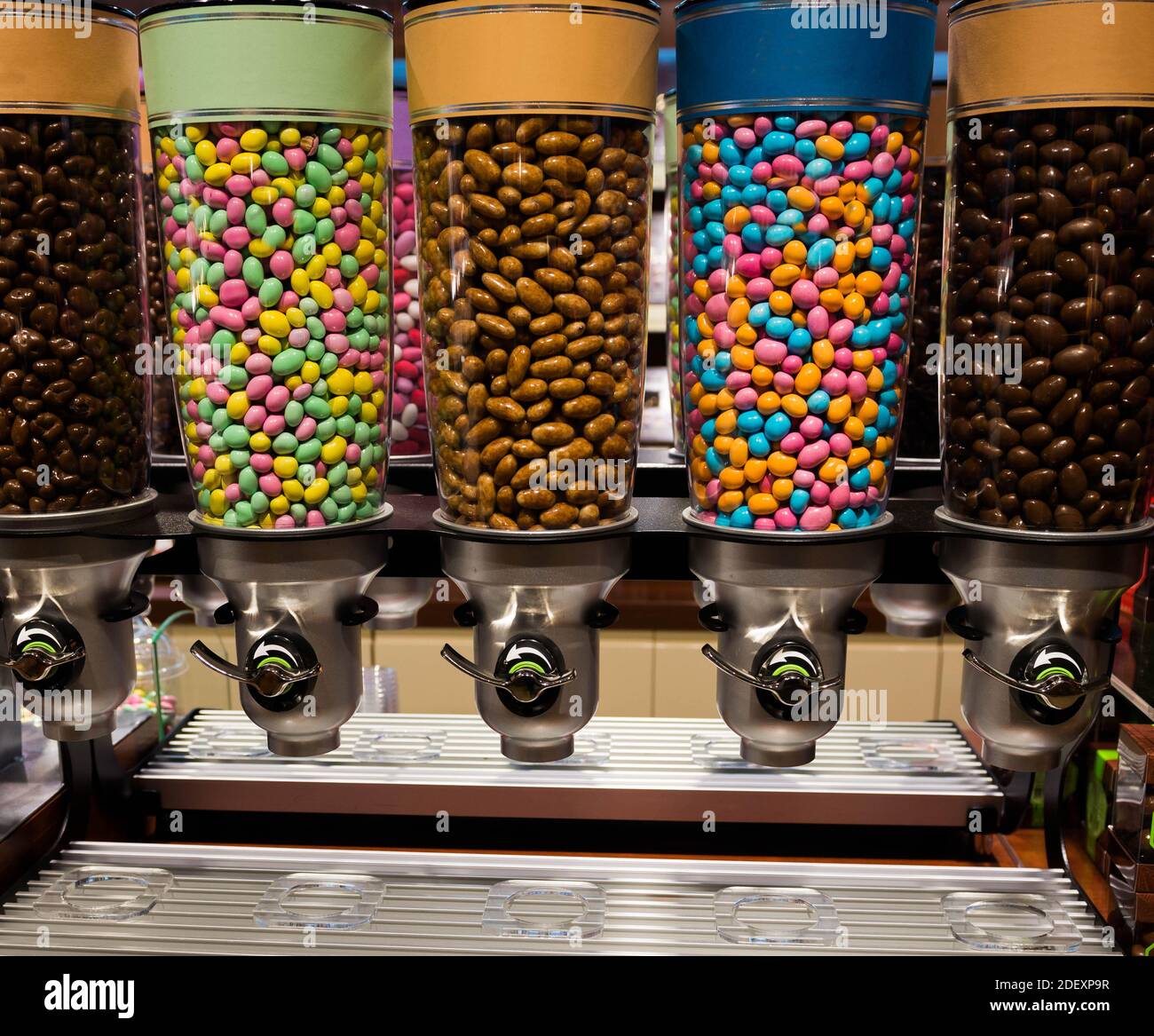 colorful candies in glass containers on a store shelf Stock Photo Alamy