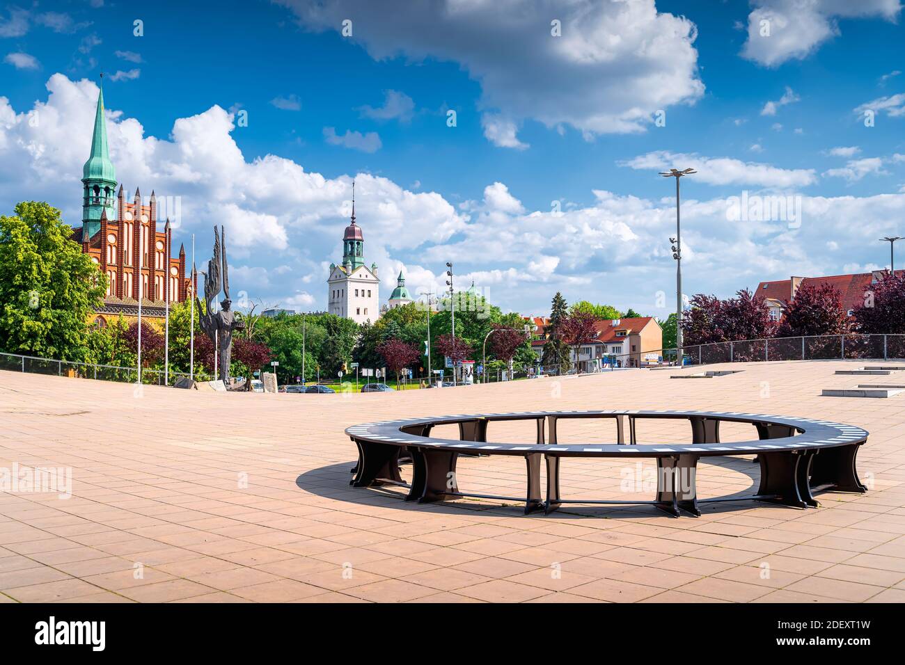Szczecin, Poland, June 2019 Circle shape bench, Angle of Freedom, church and Dukes Castle on cityscape view from Solidarity Square on bright day Stock Photo