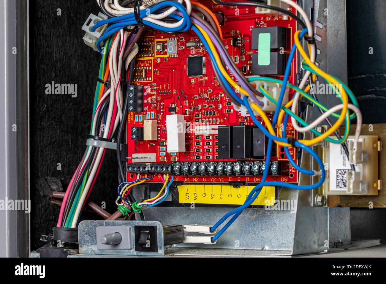 Closeup of heater circuit control board inside of furnace. Concept of