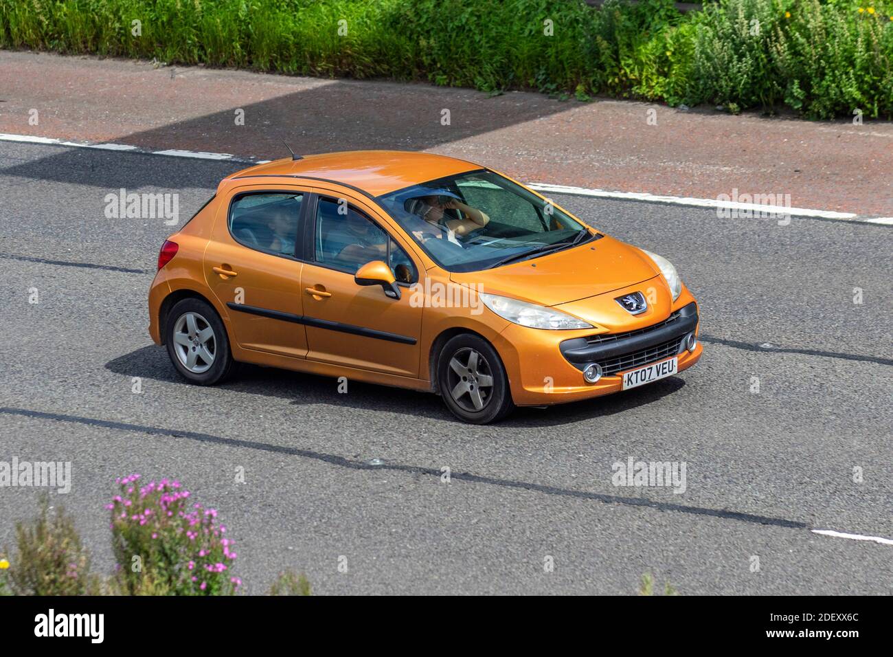 2007 orange Peugeot 207 Sport 87 1360cc petrol hatchback ; Vehicular  traffic, moving vehicles, cars, vehicle driving on UK roads, motors,  motoring on the M6 motorway highway UK road network Stock Photo - Alamy