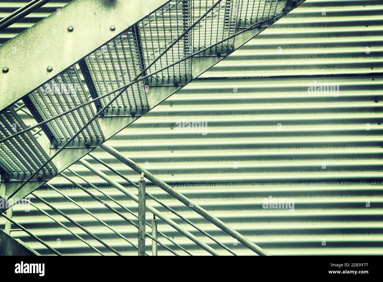 industrial iron staircase against an iron damper Stock Photo