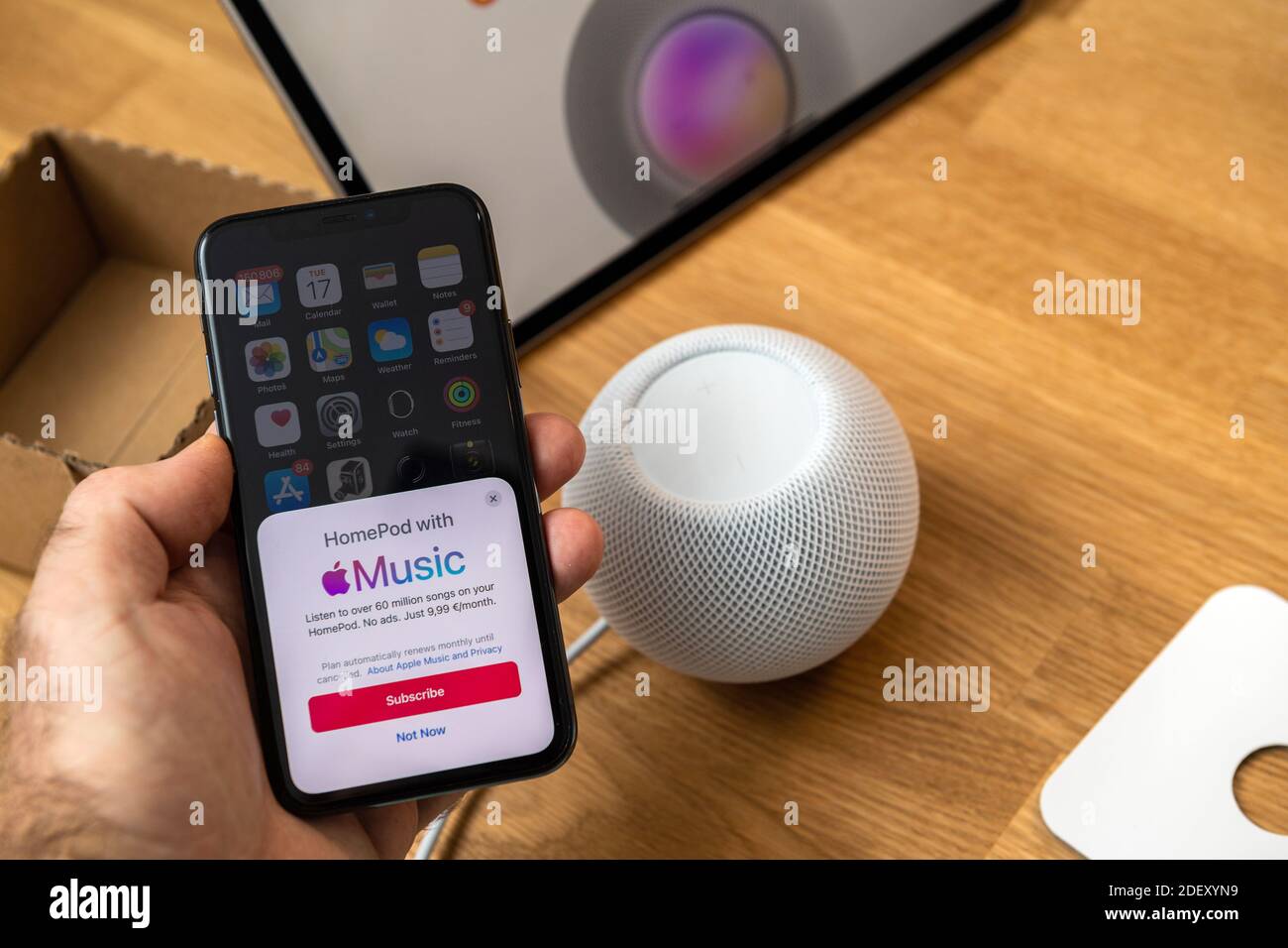 Frankfurt Germany Nov 17 2020 Man Hand Holding Iphone Next To Latest Apple Computers Homepod Mini New Small Smart Speaker Featuring Powerful Sound And Siri Personal Assistant Stock Photo Alamy