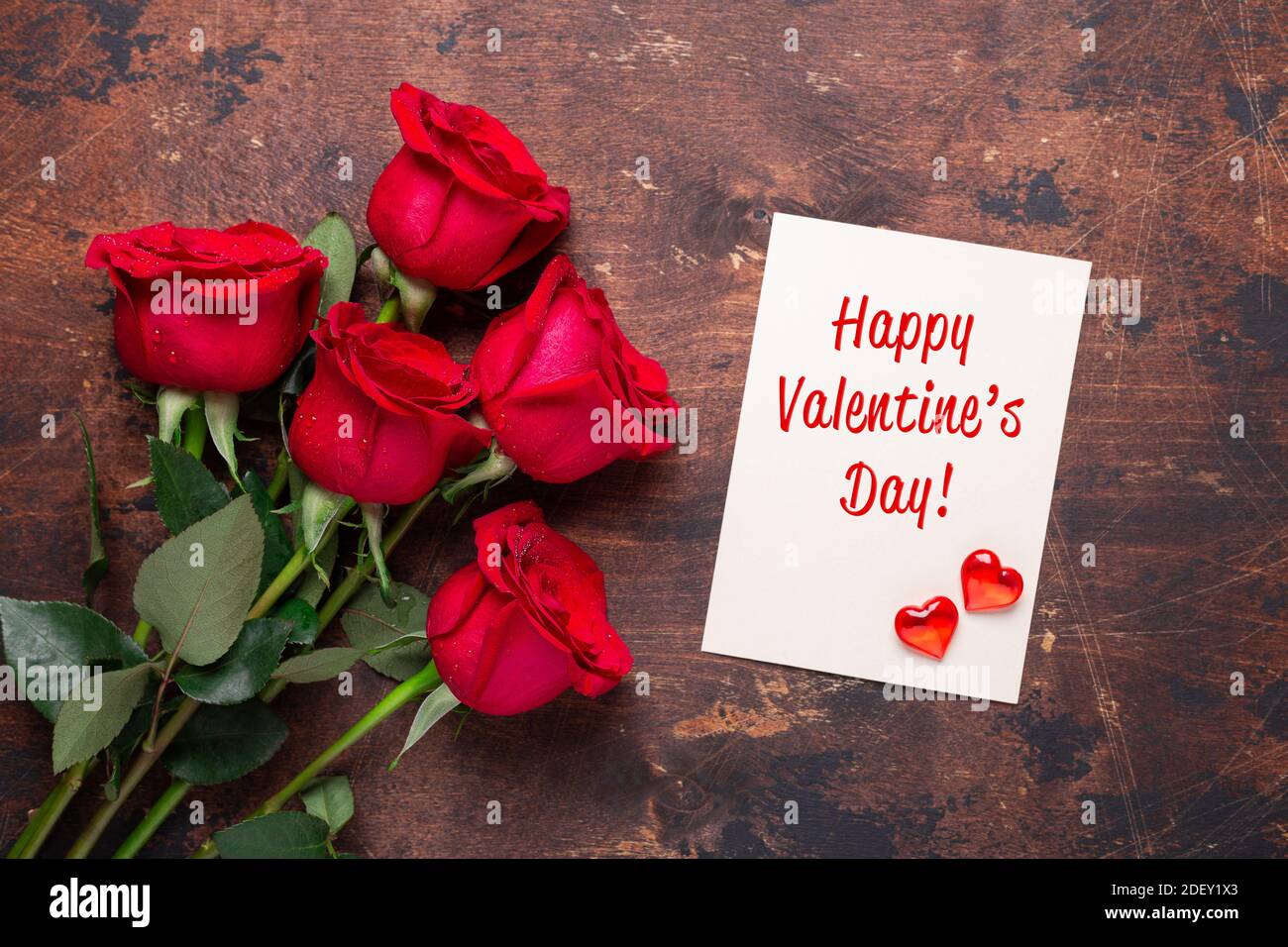 Valentine's day greeting card with red rose flowers bouquet on a ...