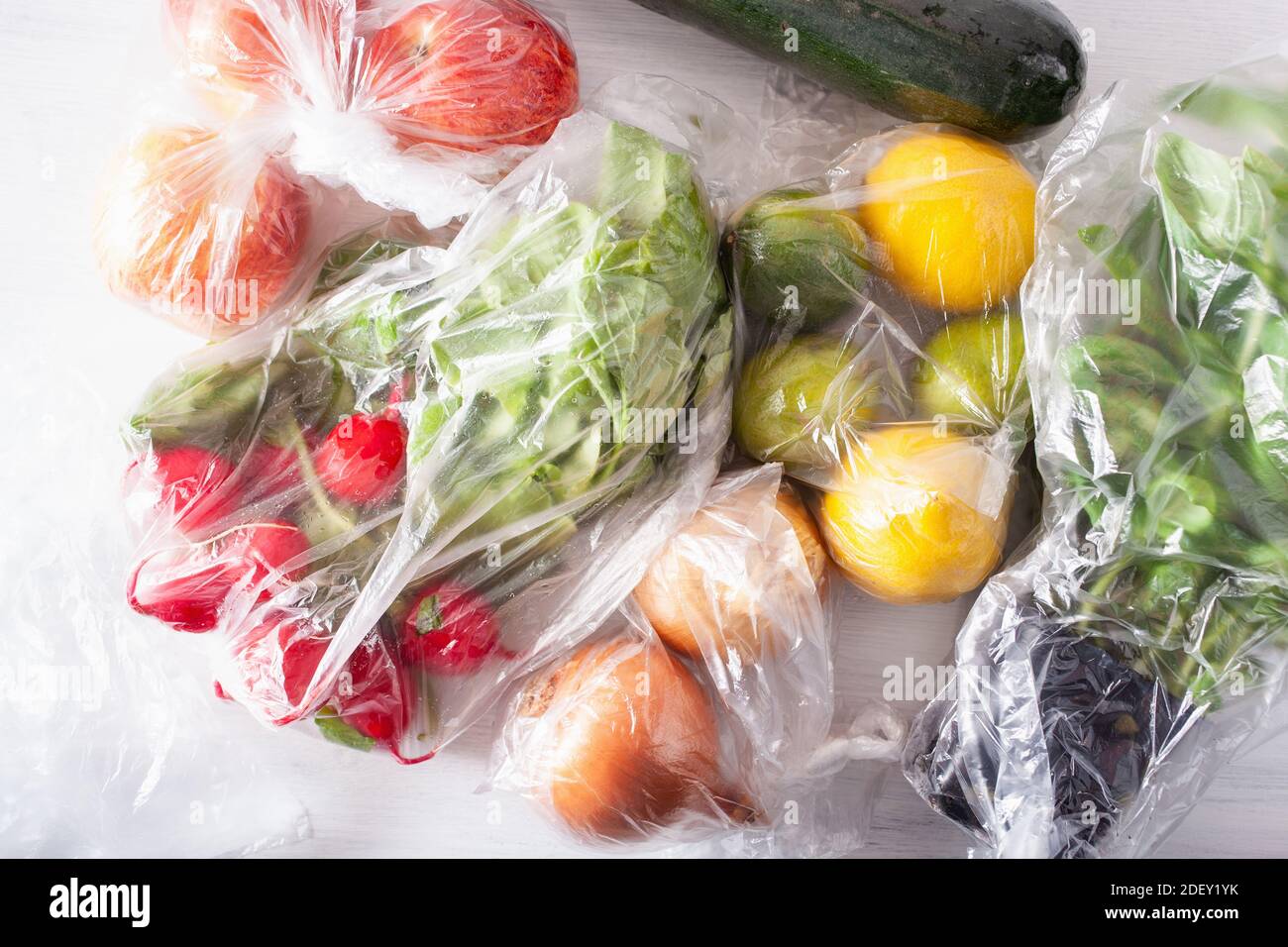 single use plastic waste issue. fruits and vegetables in plastic bags