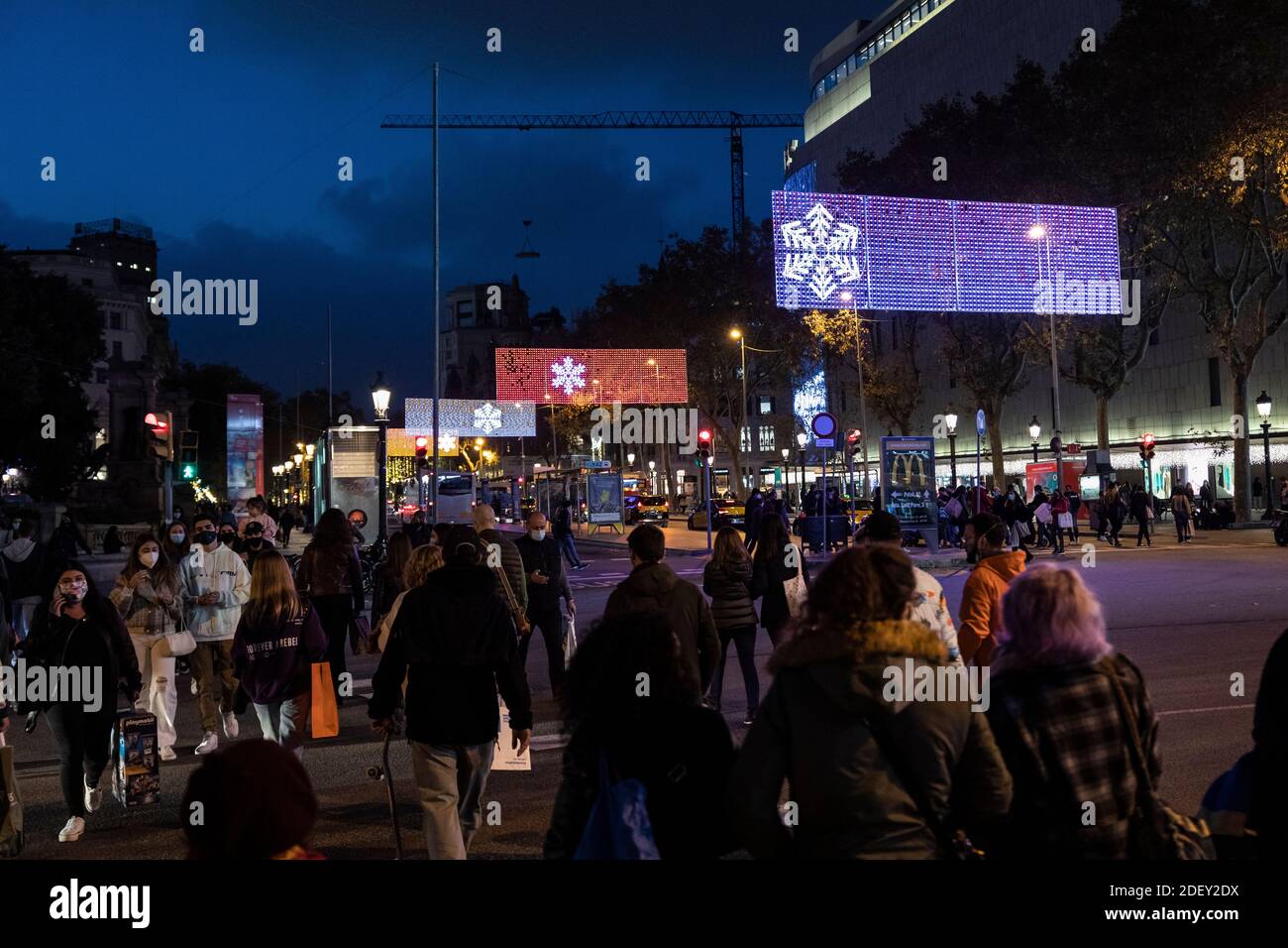 Barcelona. 30.11.2020. Christmas lights on and first Christmas shopping in the Plaça Catalunya area. Photographer: © Aitor Rodero. Stock Photo