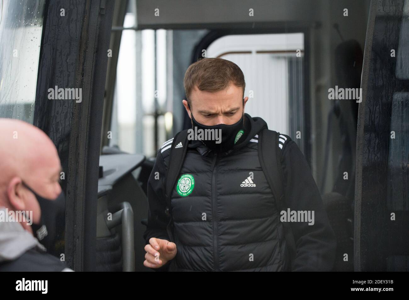 Glasgow, Scotland, UK. 2 December 2020.  Pictured: Players from Celtic Football Club seen at Glasgow Airport getting off their bus and going through security before flying out to Milan in Italy where they will play AC Milan in their group stage game 5 of 6 in Group H tomorrow evening. Glasgow, Scotland, UK. 2 December 2020.  Pictured: Players from Celtic Football Club seen at Glasgow Airport getting off their bus and going through security before flying out to Milan in Italy where they will play AC Milan in their group stage game 5 of 6 in Group H tomorrow evening.  Credit: Colin Fisher/Alamy Stock Photo