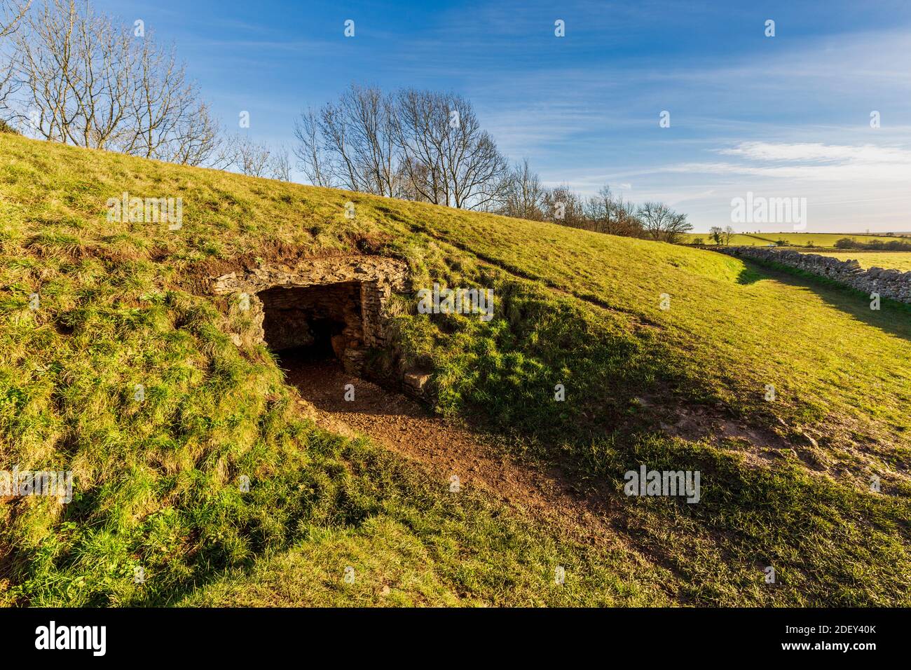A winter afternoon view of Belas Knap Neolithic Long Barrow with the west burial chamber, Gloucestershire, England Stock Photo