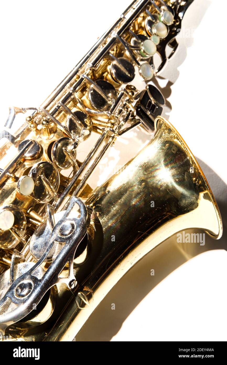 Old dented worn alto Jazz saxophone on plain background Stock Photo - Alamy