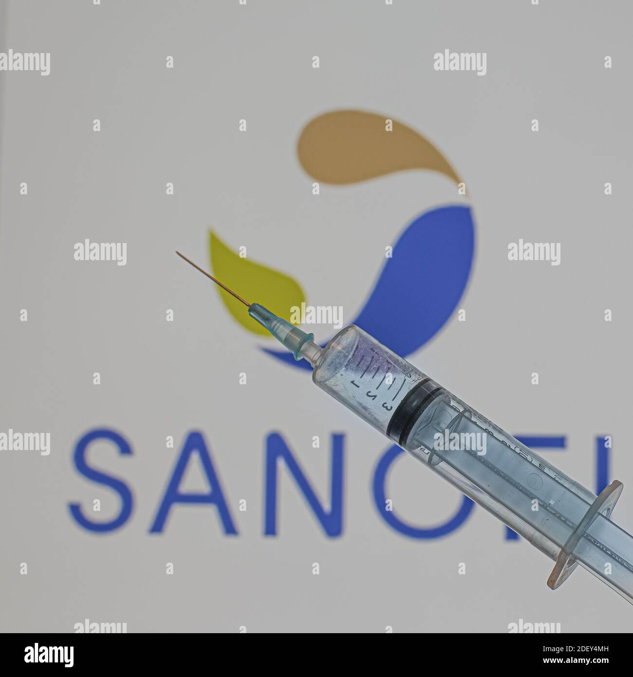 Sanofi S.A. is a multinational pharmaceutical company producing Covid-19 vaccine. A blue syringe in front of the logo, Denmark, December 2, 2020 Stock Photo