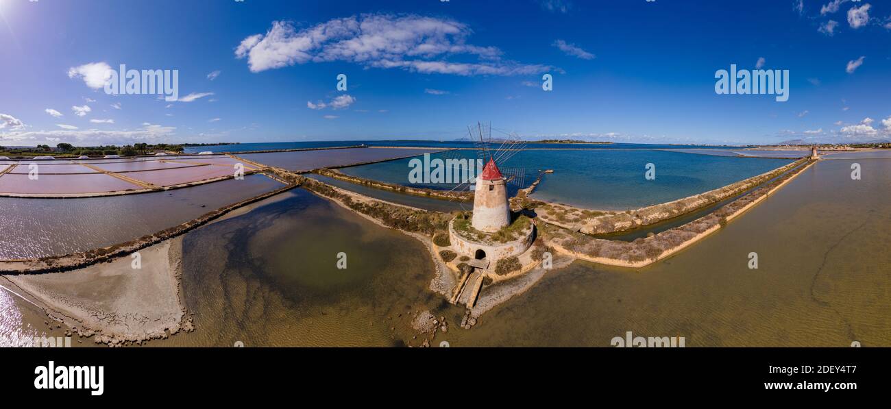 Salt Pans near Marsala, Sicily, Italy, Saline of the Laguna Marsala with a windmill. Sicily, Italy Stock Photo