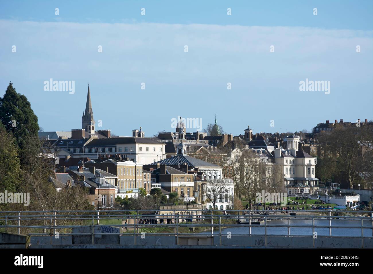 river thames frontage of richmond, surrey, england, and rooftops beyond