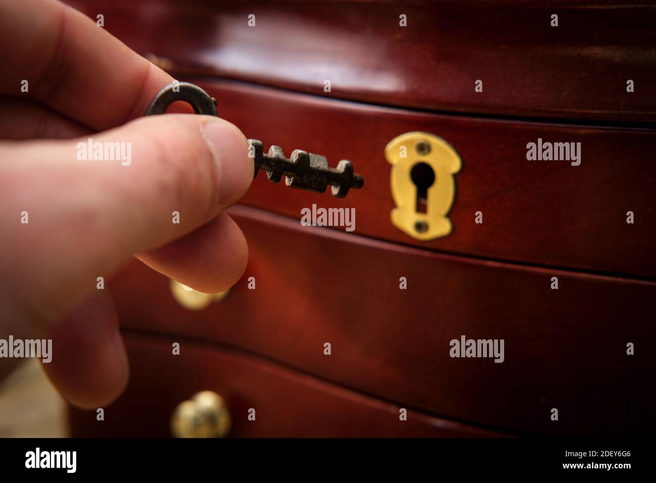 Old antique skeleton key on distressed textured wooden background Stock ...