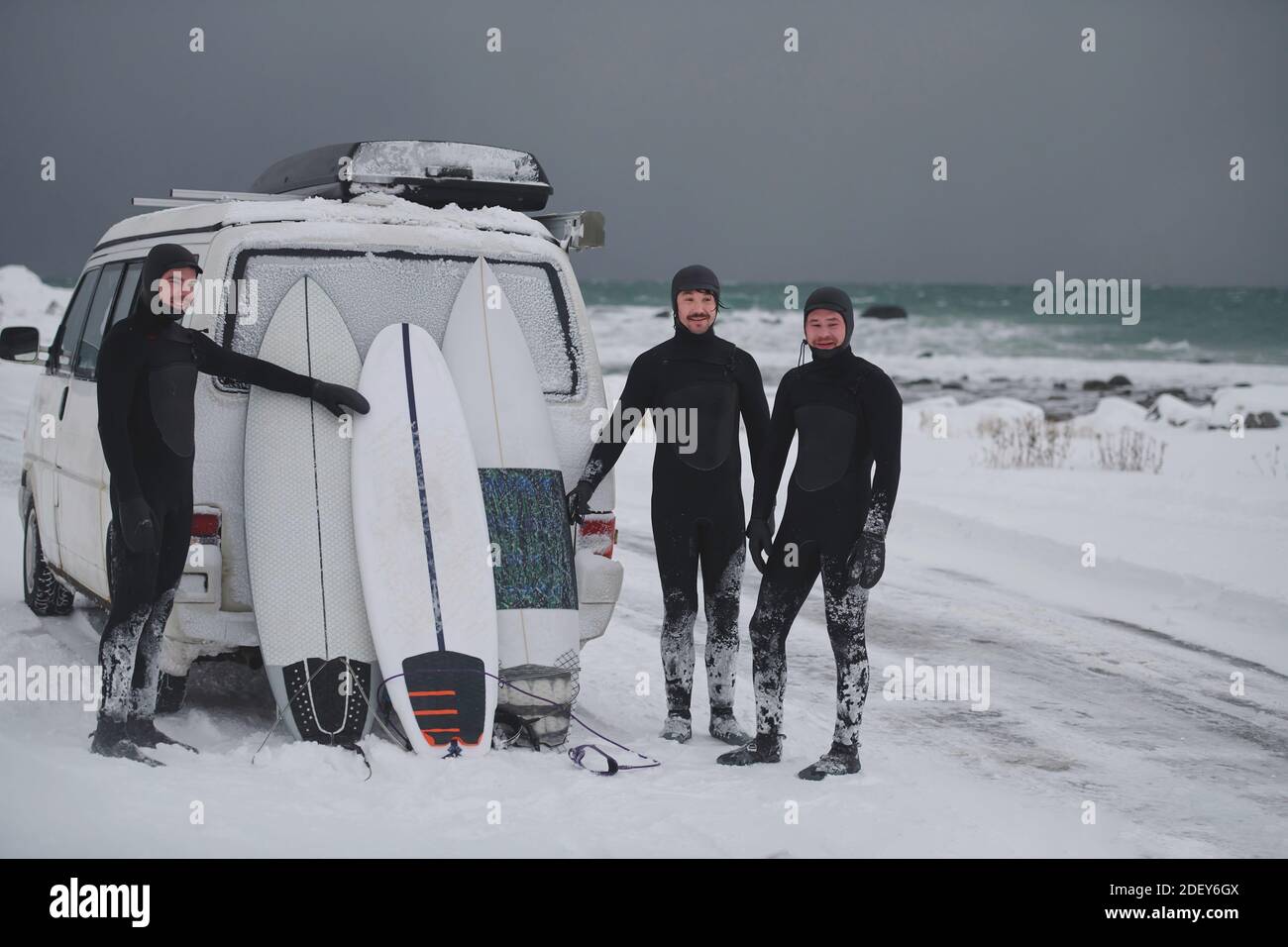 Arctic surfers in wetsuit after surfing by minivan Stock Photo Alamy