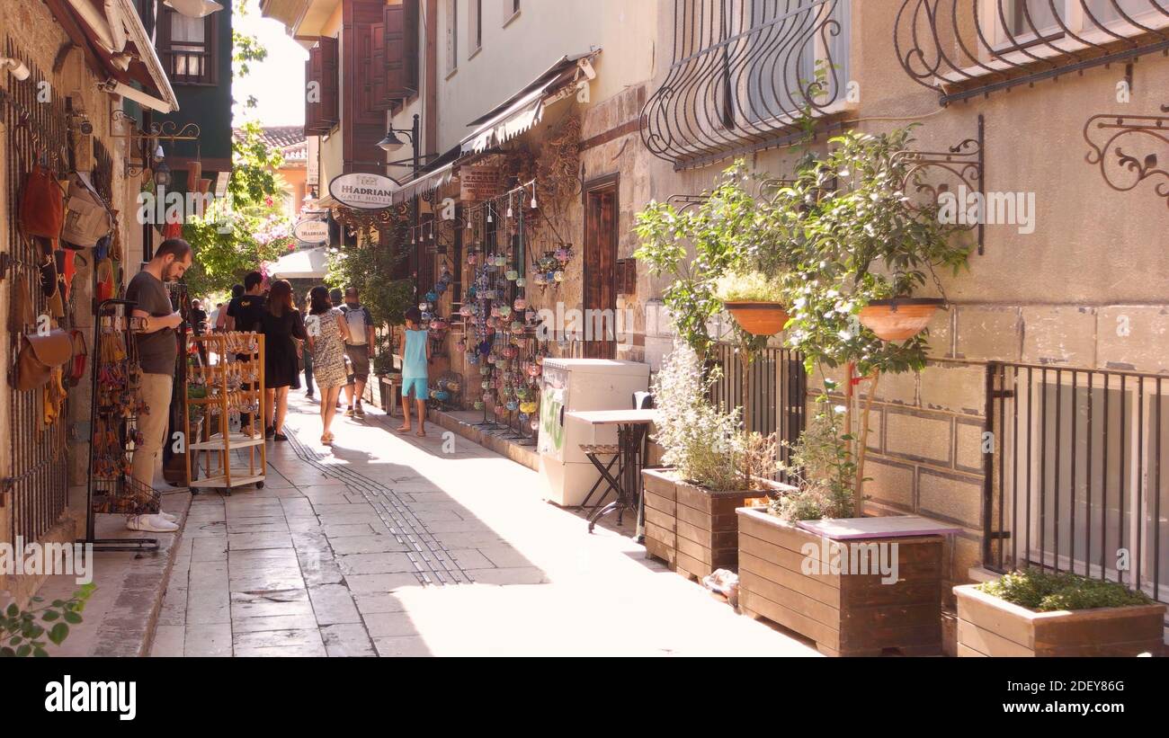 Street with walking tourists of old town Kaleici, Antalya, Turkey. Stock Photo