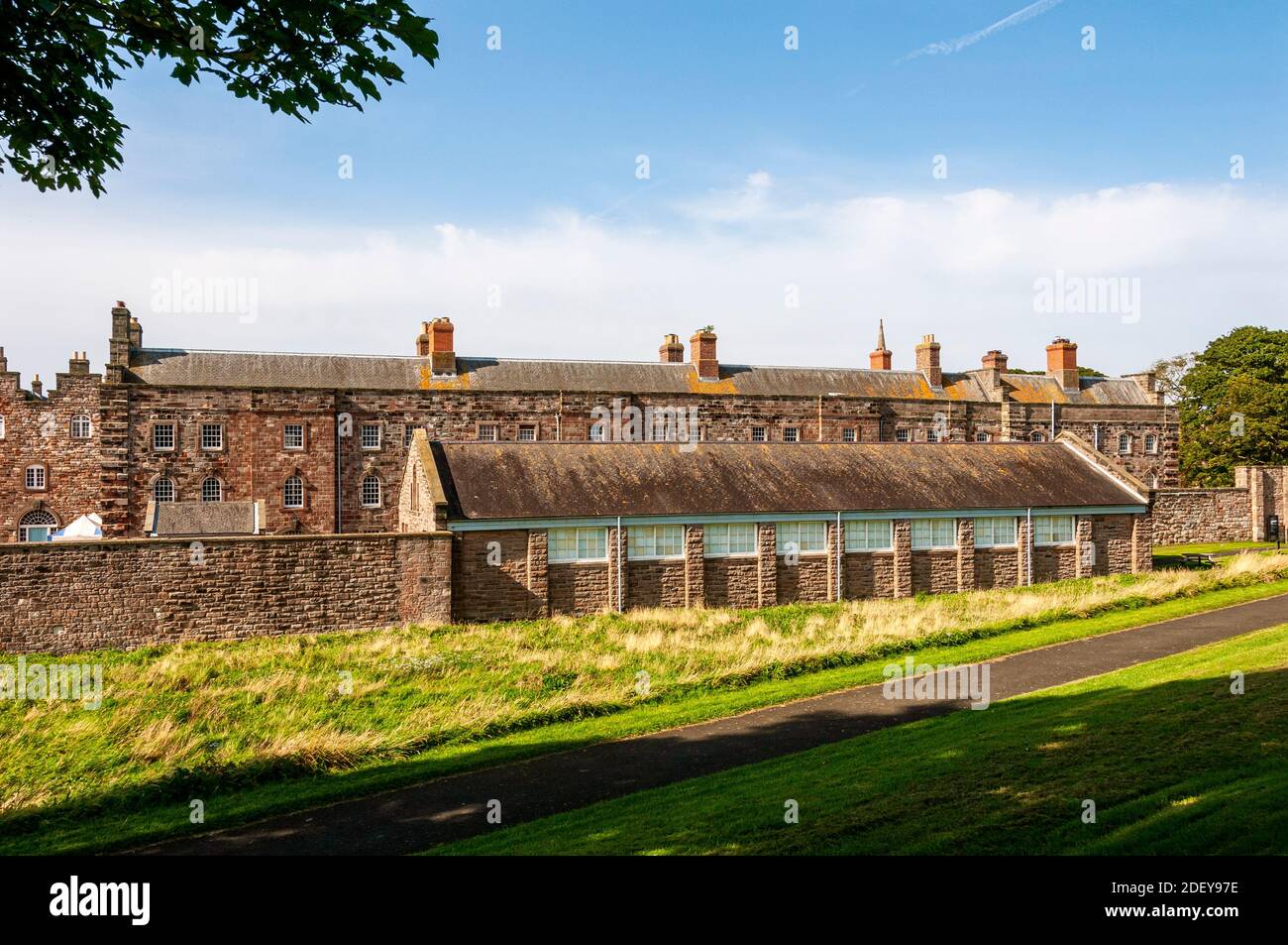 The distinctive three storey accommodation blocks to house soldiers and officers at Berwick Barracks having windows with arched heads for the latter Stock Photo