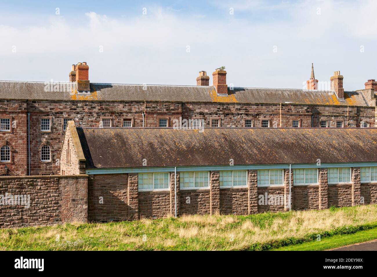 One of the three storey accommodation blocks to house 200 soldiers and officers at Berwick Barracks having windows with arched heads for the latter Stock Photo