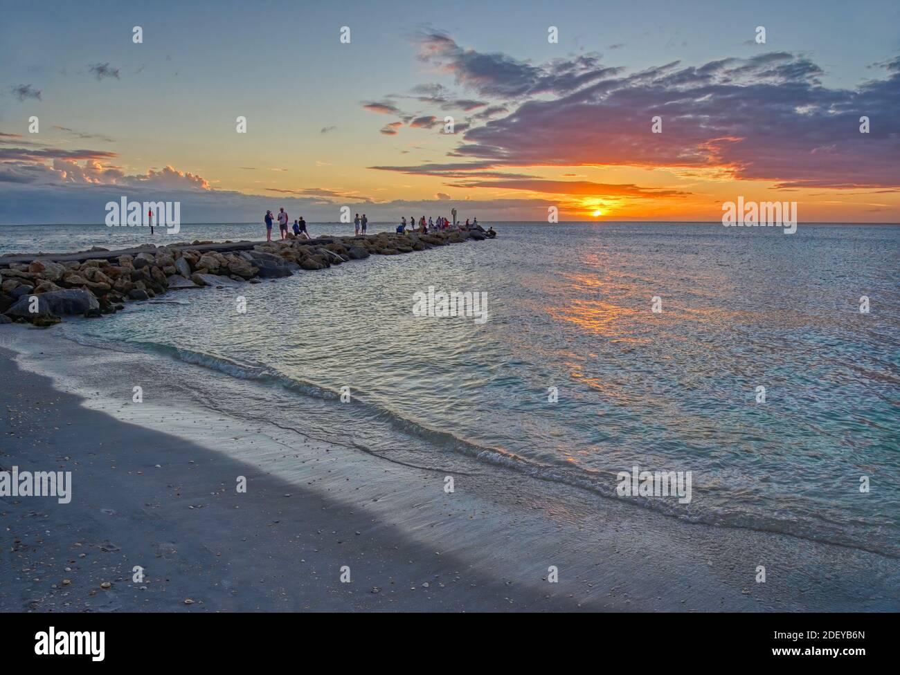 People on the North Jetty into the Gulf of Mexico in Nokomis Florida in the United States Stock Photo