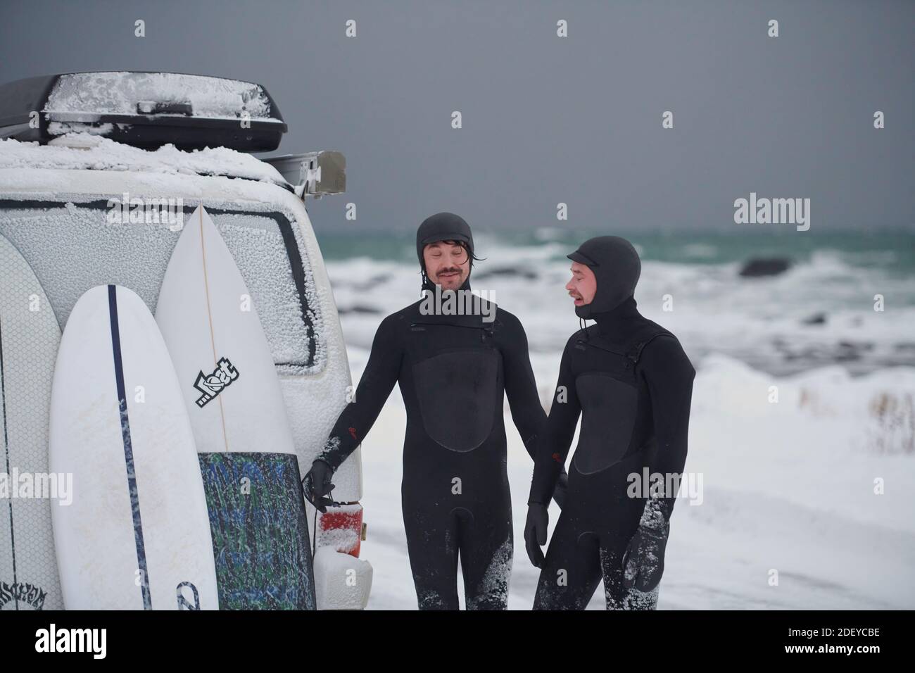 Arctic surfers in wetsuit after surfing by minivan Stock Photo Alamy
