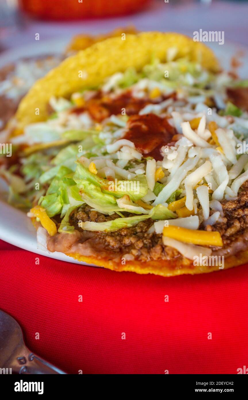 Authentic Mexican taco enchilada and tostada with refried beans and