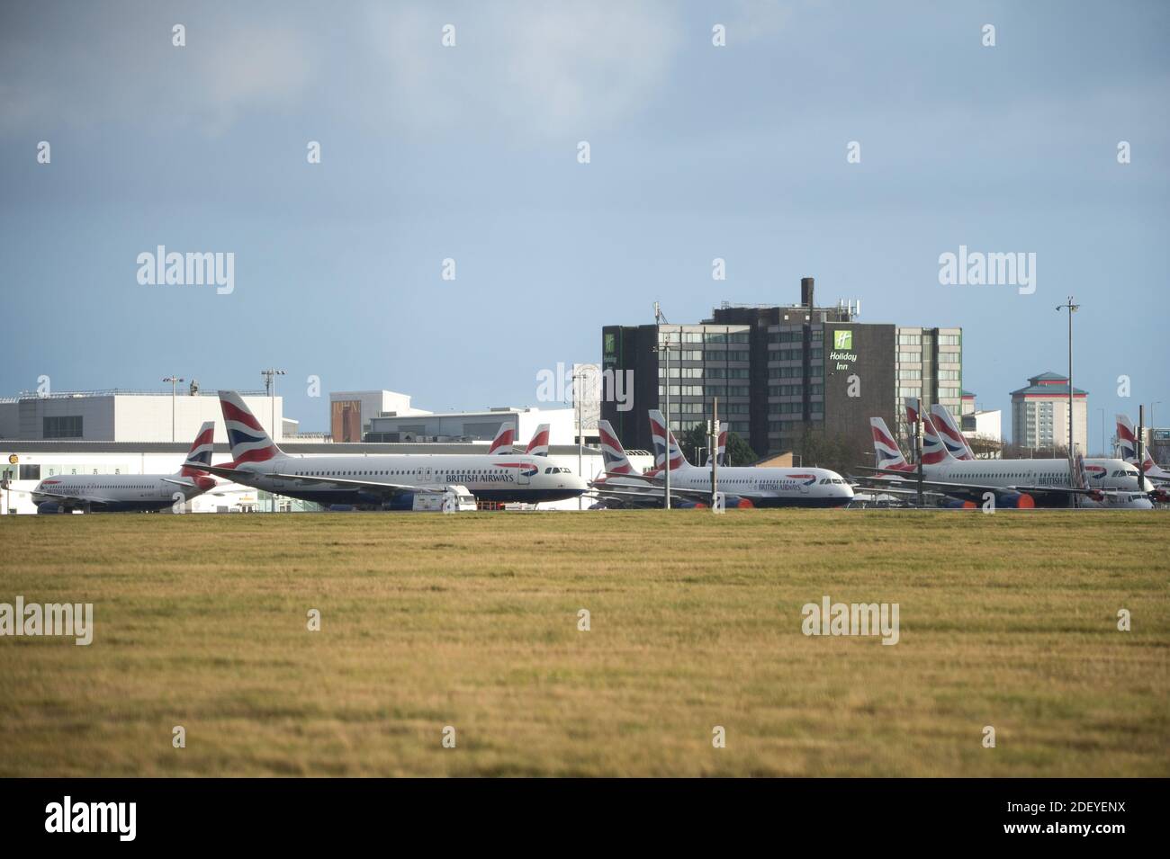 Glasgow, Scotland, UK. 2nd Dec, 2020. Pictured:British Airways airbus jets still stand grounded due to the coronavirus (COVID19) pandemic. Due to the uncertainty and a massive and unprecedented downturn in the global airline industry, British Airways (BA) have laid over a quarter of their staff. Glasgow Airport have now parked the grounded jets over to a smaller area of the tarmac as they used to occupy part of the airports second runway. Credit: Colin Fisher/Alamy Live News Stock Photo