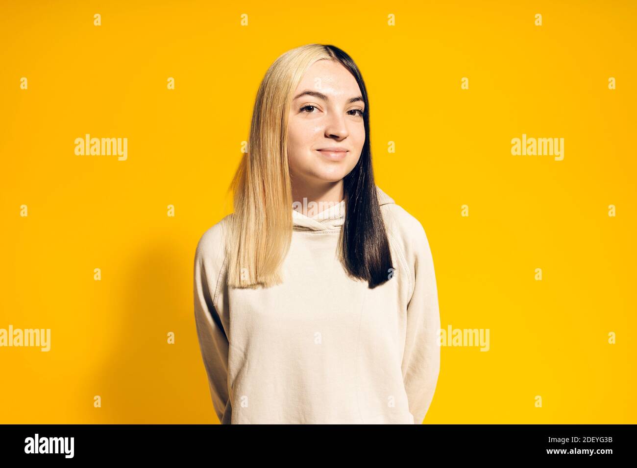Stock photo of young happy girl posing in studio Stock Photo - Alamy