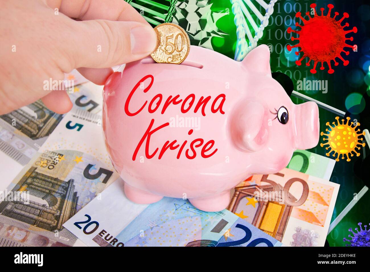 Sparschwein mit 50 Cent Euromünze  mit Hand und Corona Virus Stock Photo