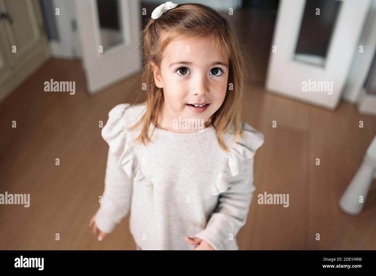 Stock photo of cute little girl smiling and looking at camera Stock ...