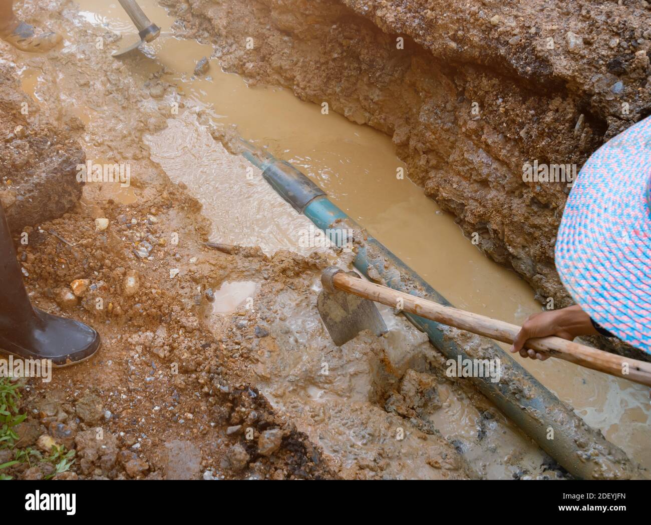 plumber work dig repair water line connect PVC pipe main plumbing on