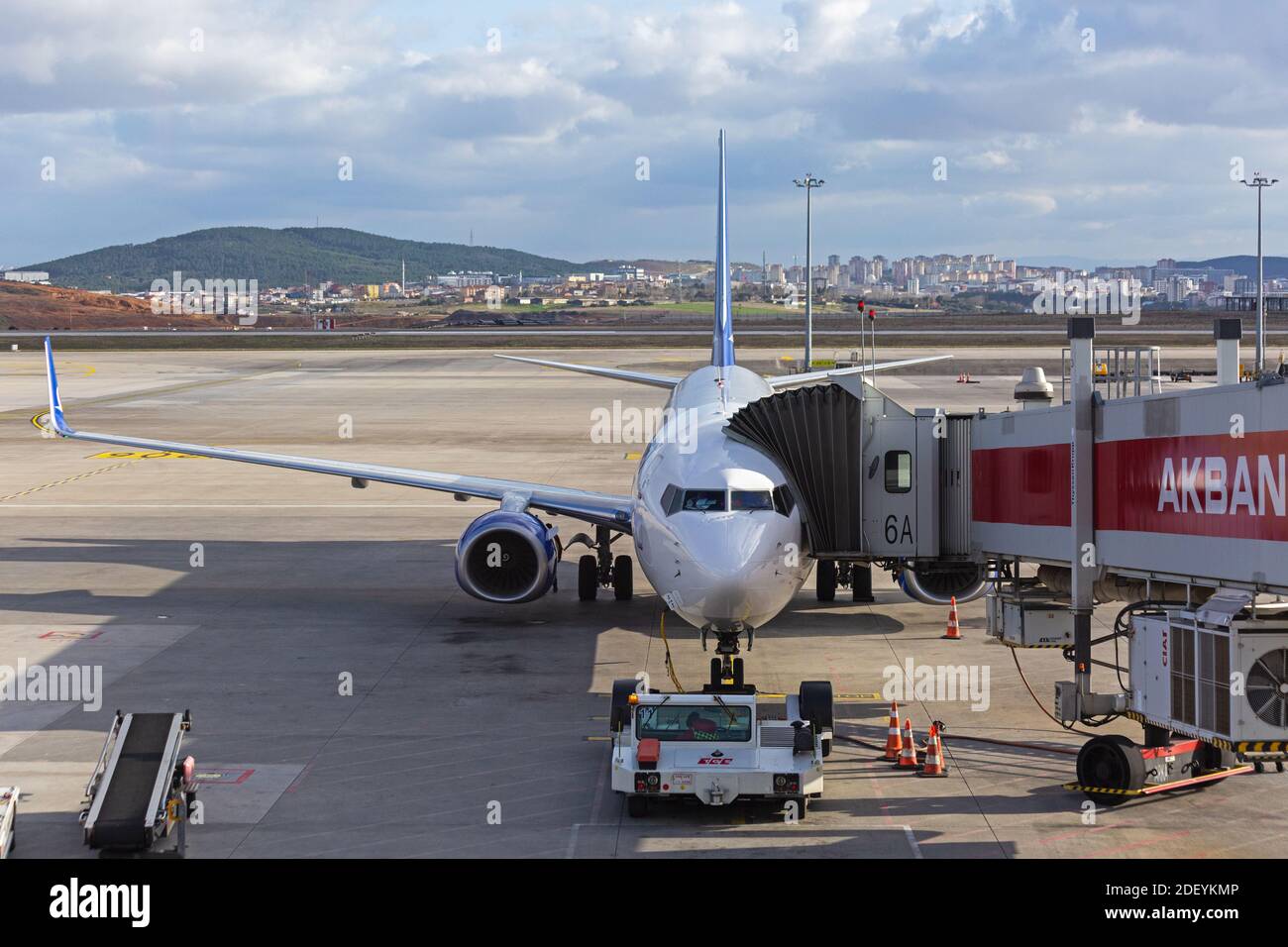 Front view of Boeing 737 jet of Anadolujet connected to jet bridge on airport ramp. Stock Photo