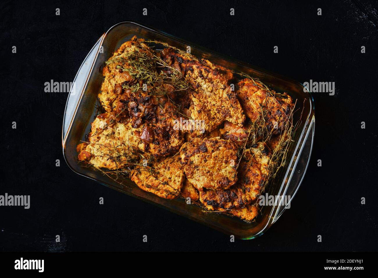 Pork chop fillet baked in oven with seasoning and herbs Stock Photo Alamy